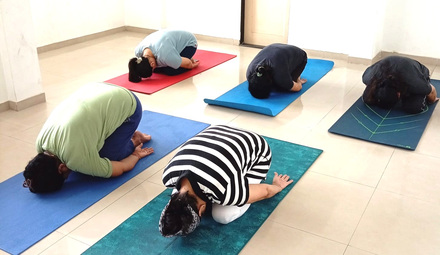 Person resting in Balasana, Child's Pose